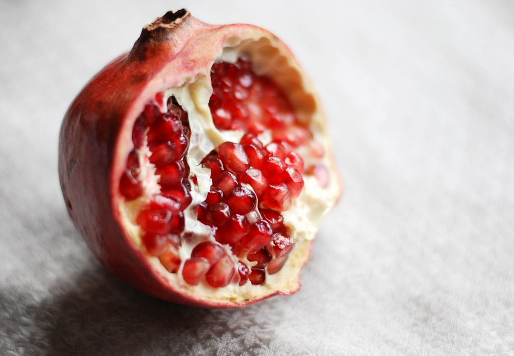 selective color photography of pomegranate