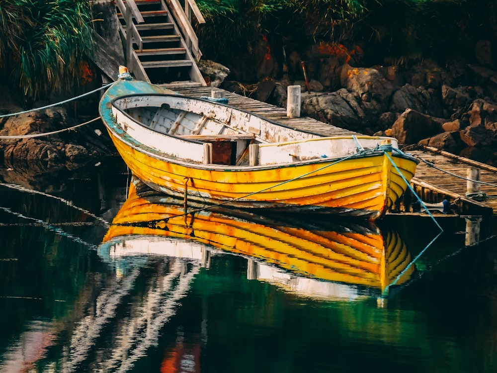 empty yellow boat on dock