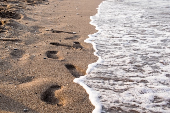 foot prints on shore at daytime in Rhodes Greece