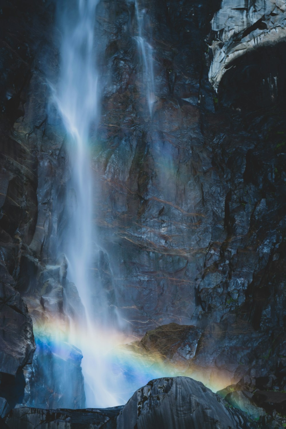 waterfalls with rainbow during daytime