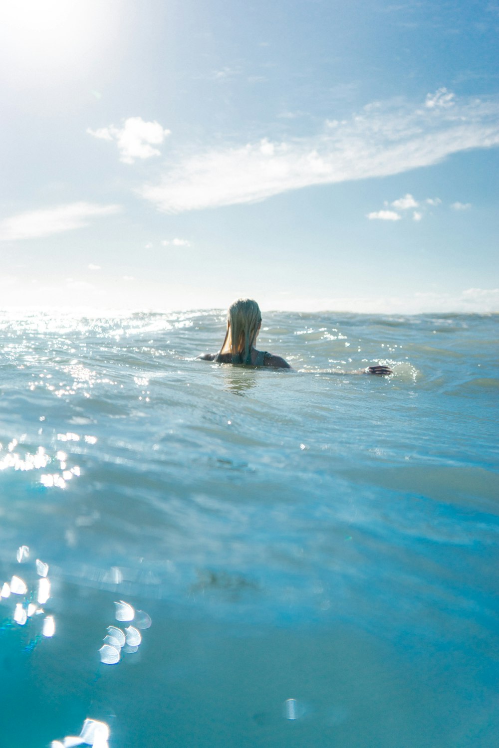 woman on body of water during daytime