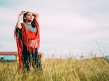 woman standing while closing her eyes