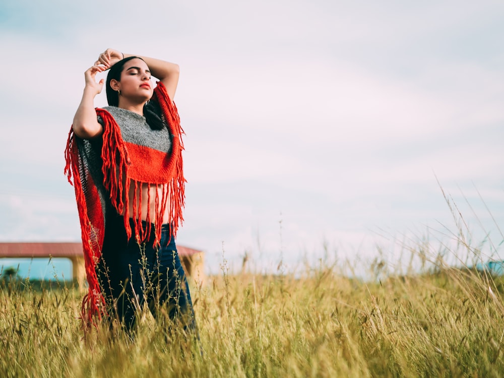 woman standing while closing her eyes