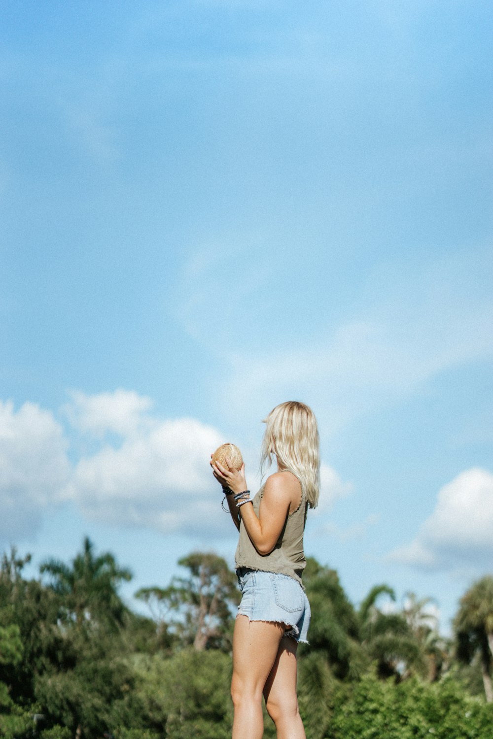 woman holding coconut shell