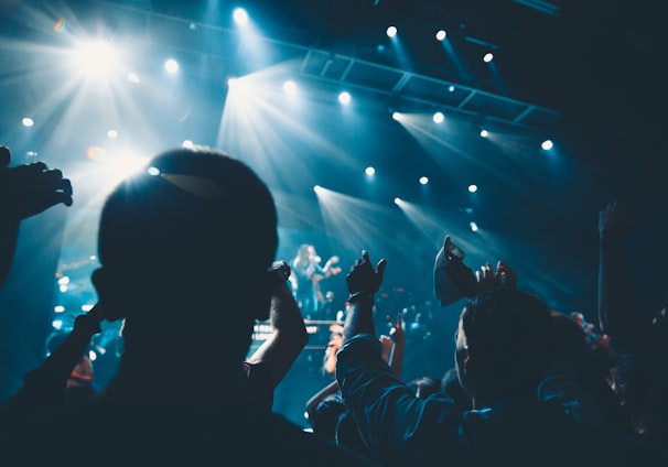 people standing in front of stage