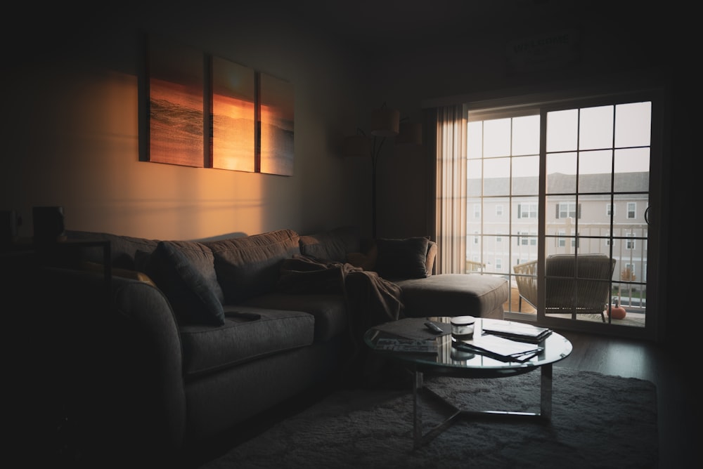 sectional sofa near coffee table and window