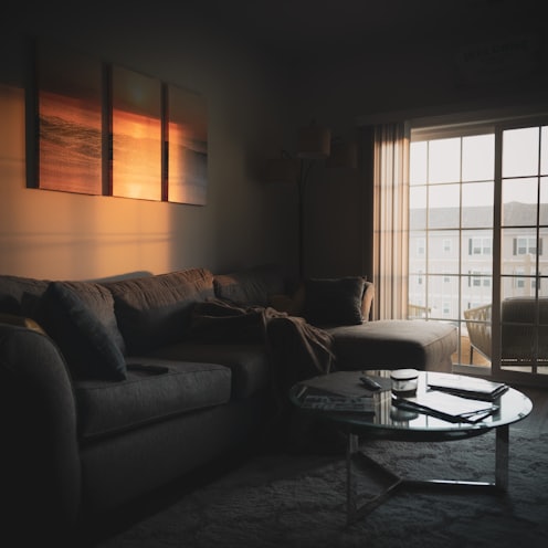 sectional sofa near coffee table and window