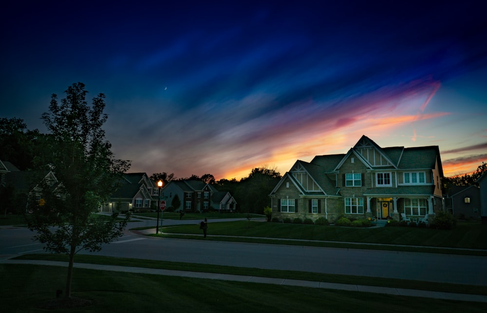 gray wooden house during sunset