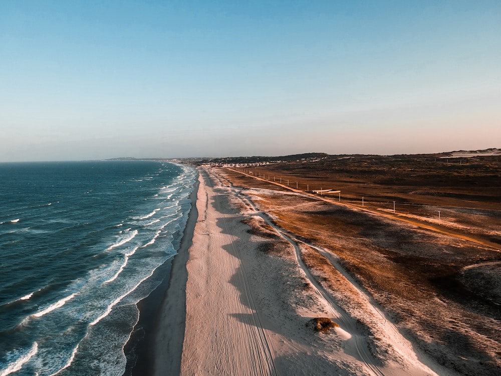 aerial photo of shoreline beside body of water