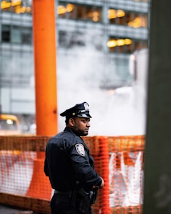 chief standing near body of water