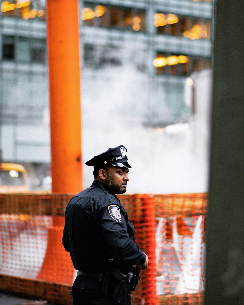 chief standing near body of water