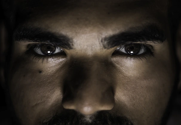 Artistic shot of a client’s face highlighting symmetrical, sculpted eyebrows