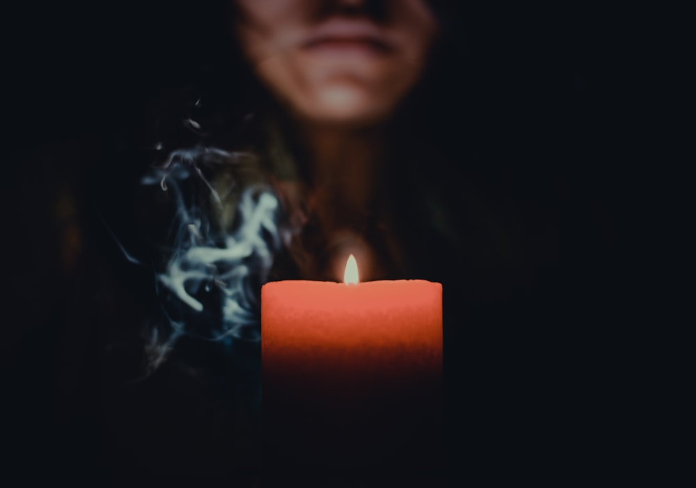 person behind candle
