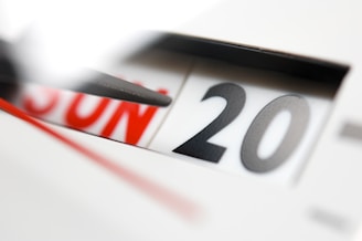 A close-up of a calendar with a date circled in bright red.