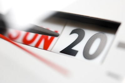 A close-up of a calendar with a date circled in bright red.