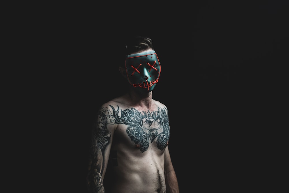 man standing while wearing black mask