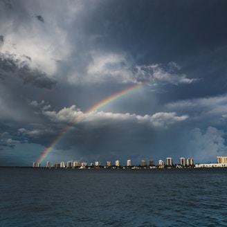 rainbow over cityscape during daytime