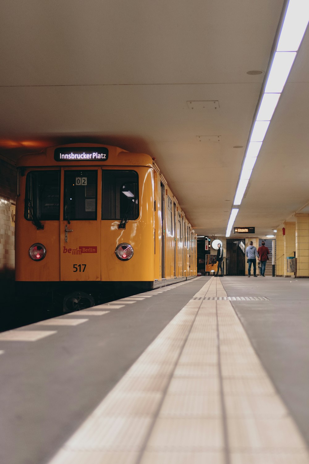 people standing near train