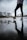 person in black pants stepping on skateboard
