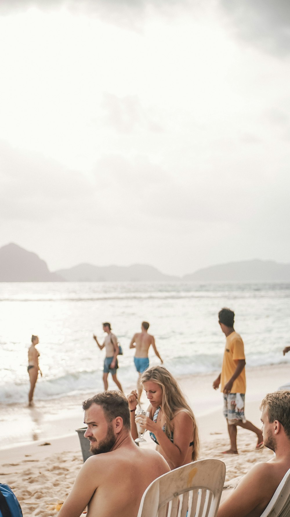 group of people enjoying the summer on the beach