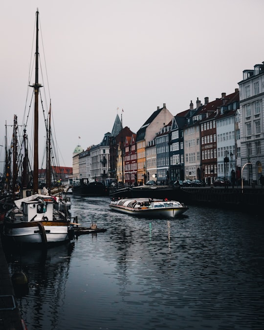 boats on body of water near high rise concrete buildings in Mindeankeret Denmark