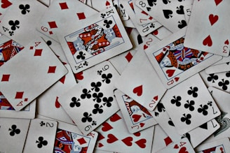 a pile of playing cards sitting on top of each other