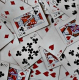 a pile of playing cards sitting on top of each other
