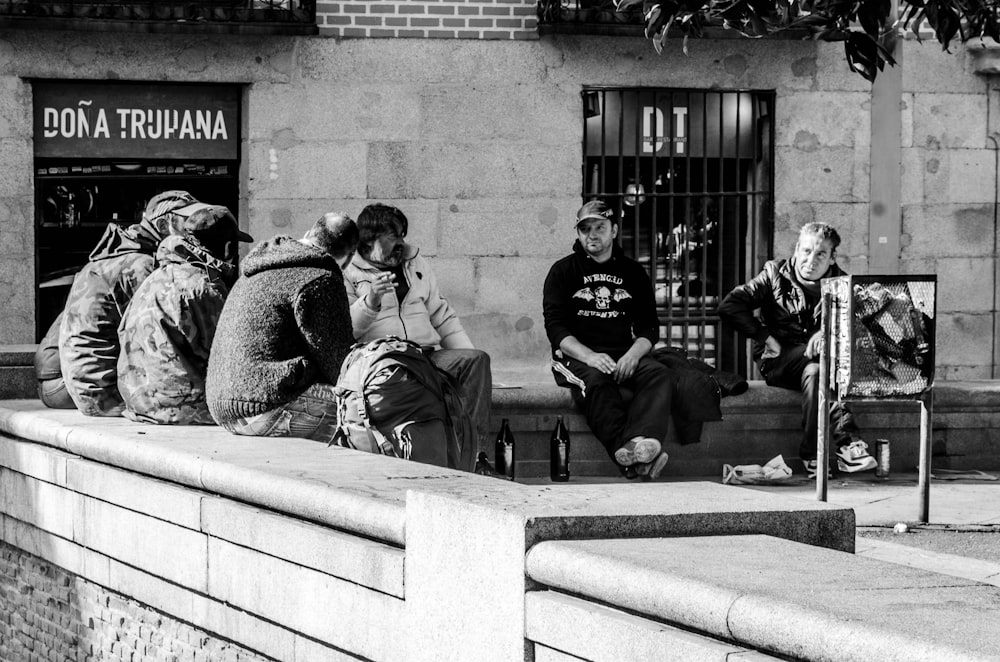 people sitting on fence