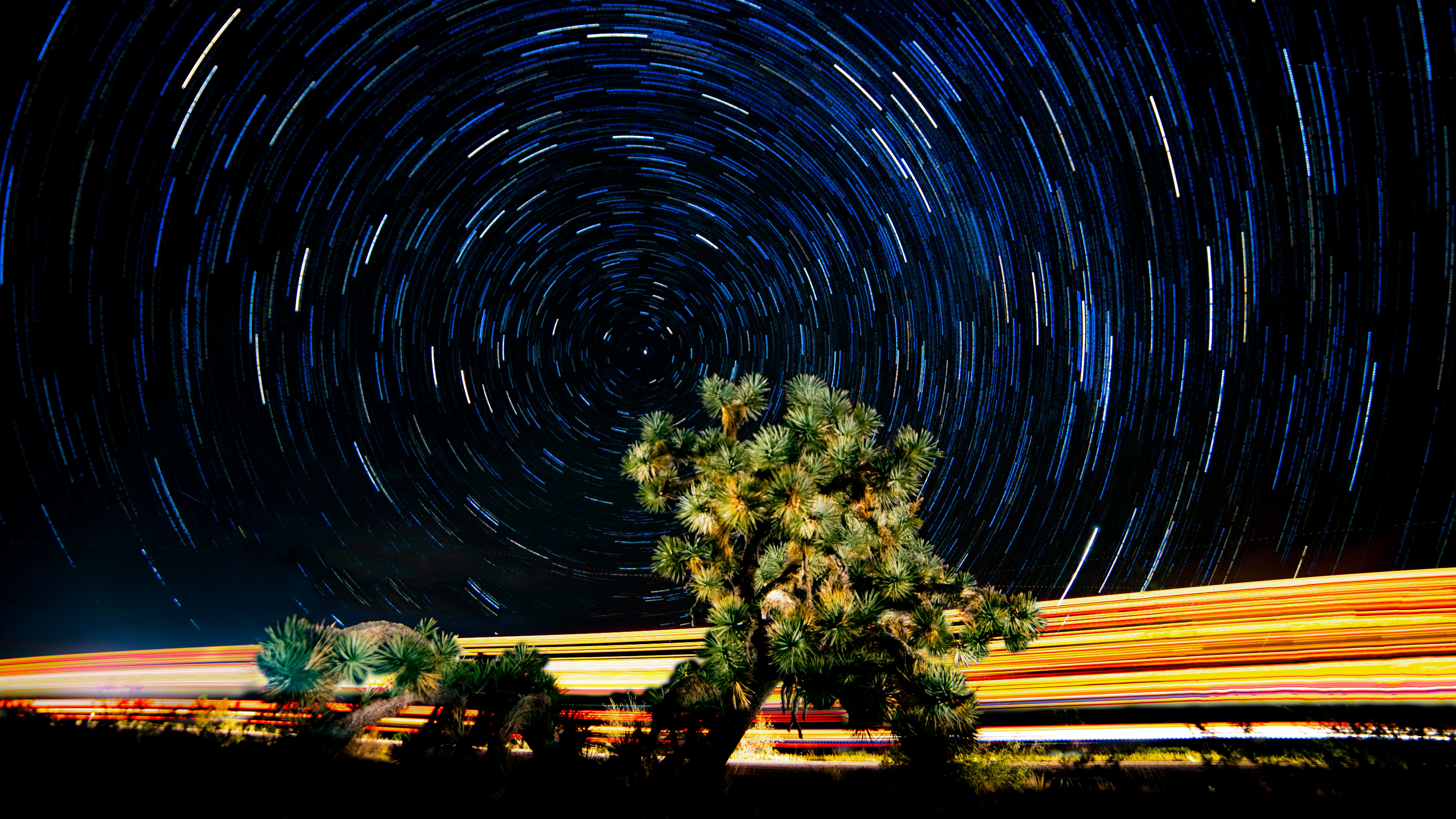 green trees, I wondered what would happen if I took a bunch of pictures in a rural area near a busy highway and how the star trails would layer in with the movement of the cars.  I had a thought of what it would look like, this is not it, but I ended up liking it a lot.  Hope you do as well.