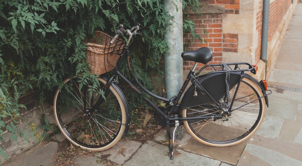 parked black commuter bike near building