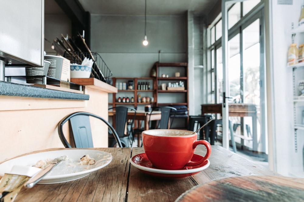 red ceramic teacup