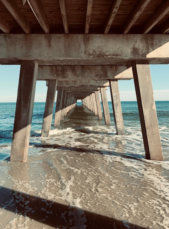 gray concrete bridge on seashore in Tybee Island United States
