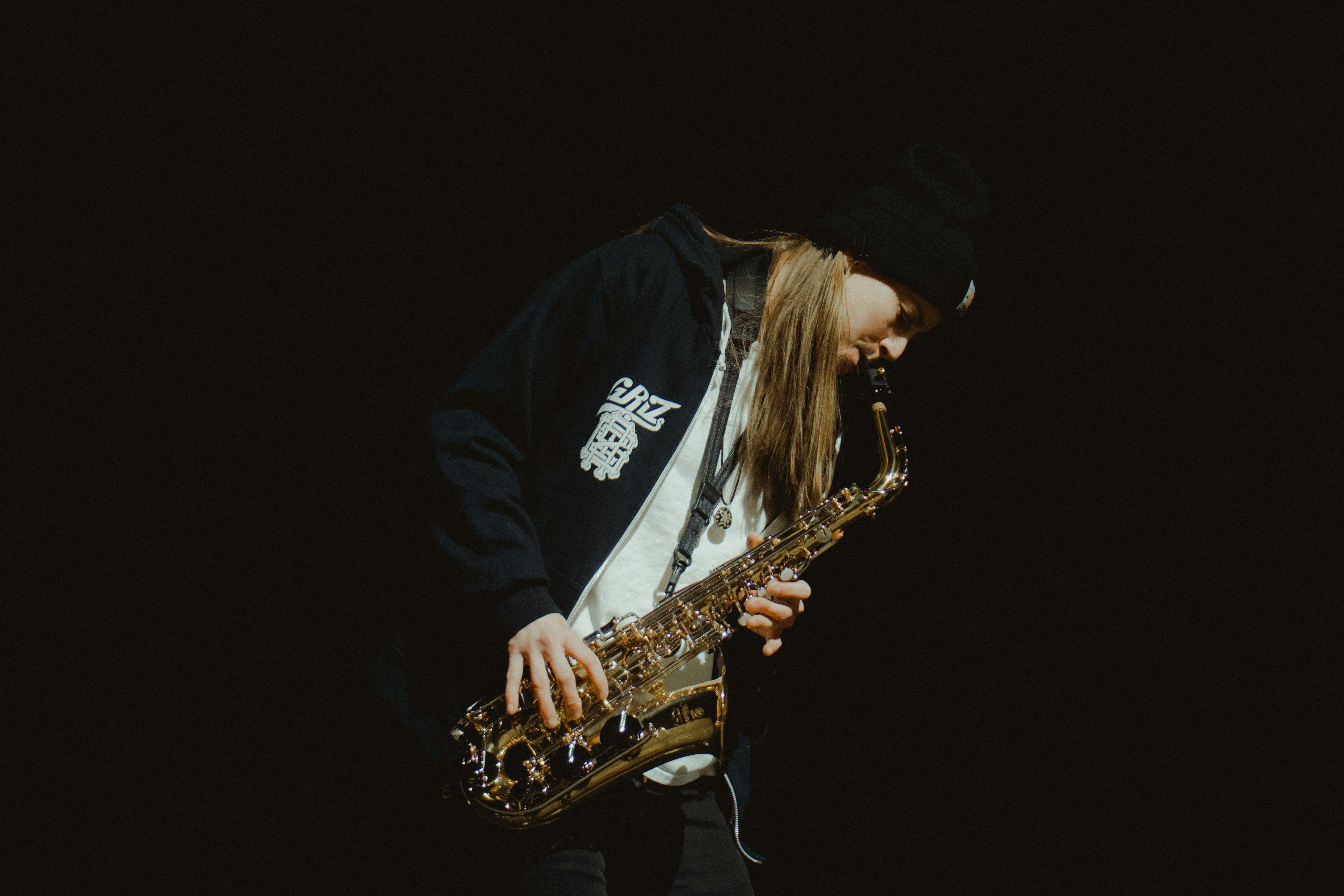 EDM artist Grant Kwiecinski (a.k.a GRiZ) playing his saxophone.