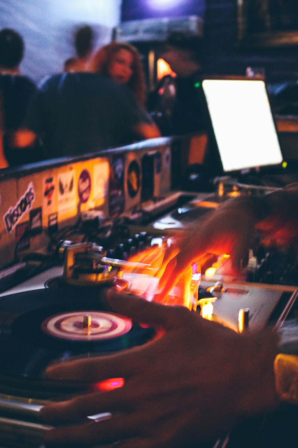 person holding black and grey DJ turntable