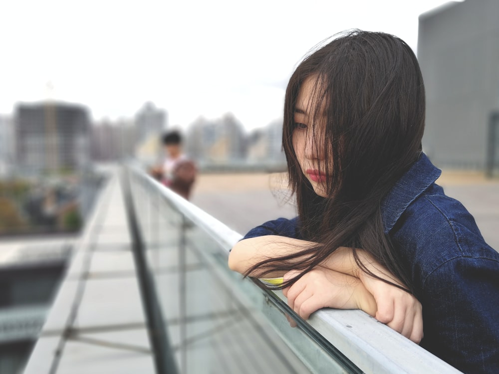 woman wearing blue denim jacket