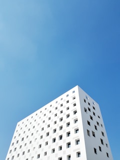 white painted building under blue sky
