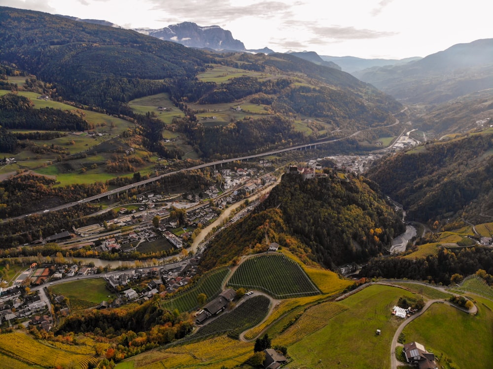 aerial photography of green fields and concrete roads at daytime