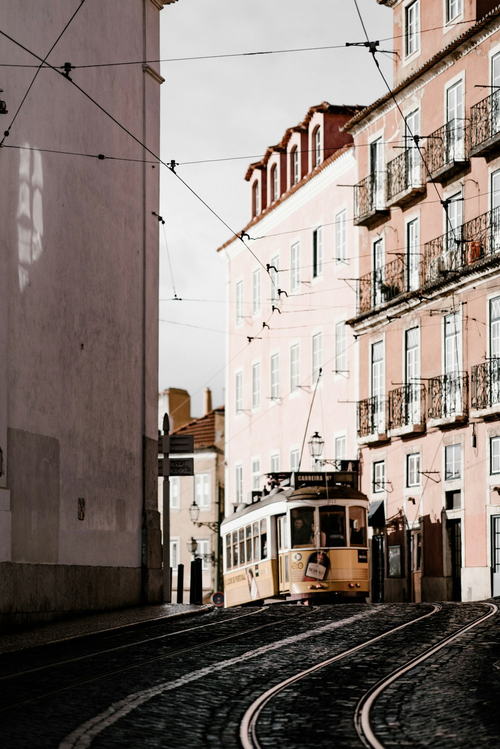beige tram in city