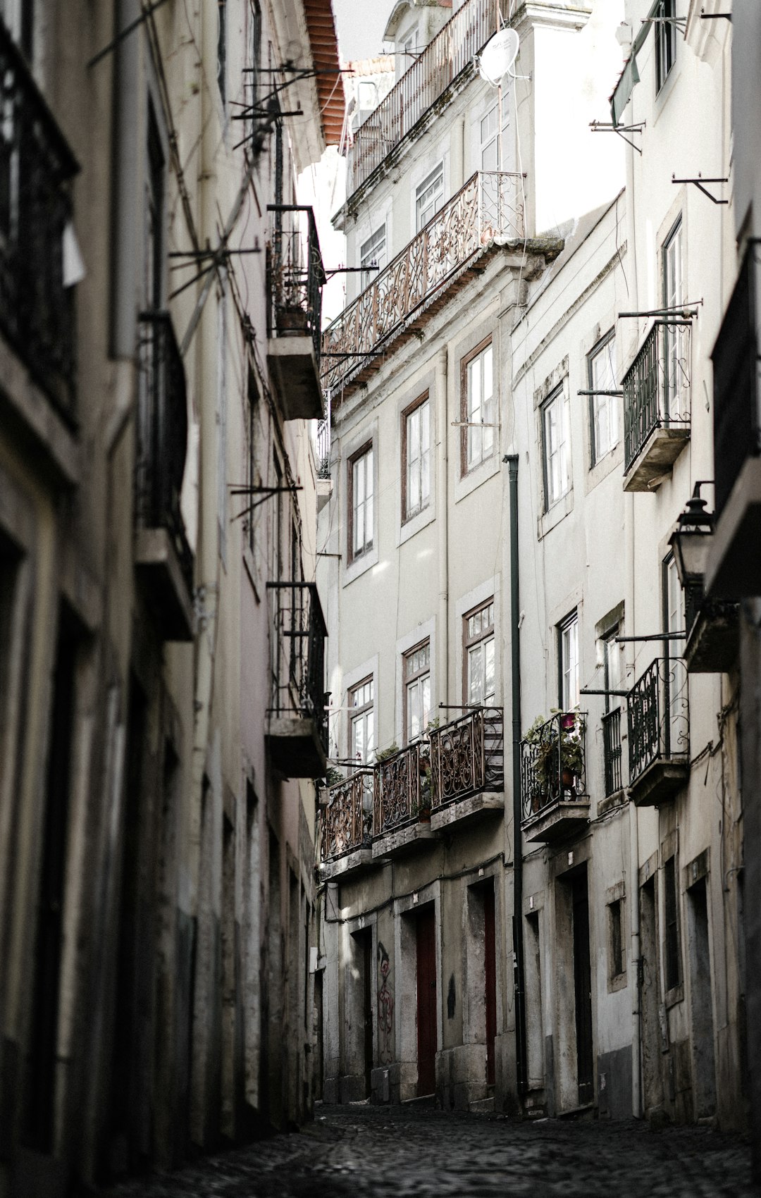 empty concrete road surrounded by buildings