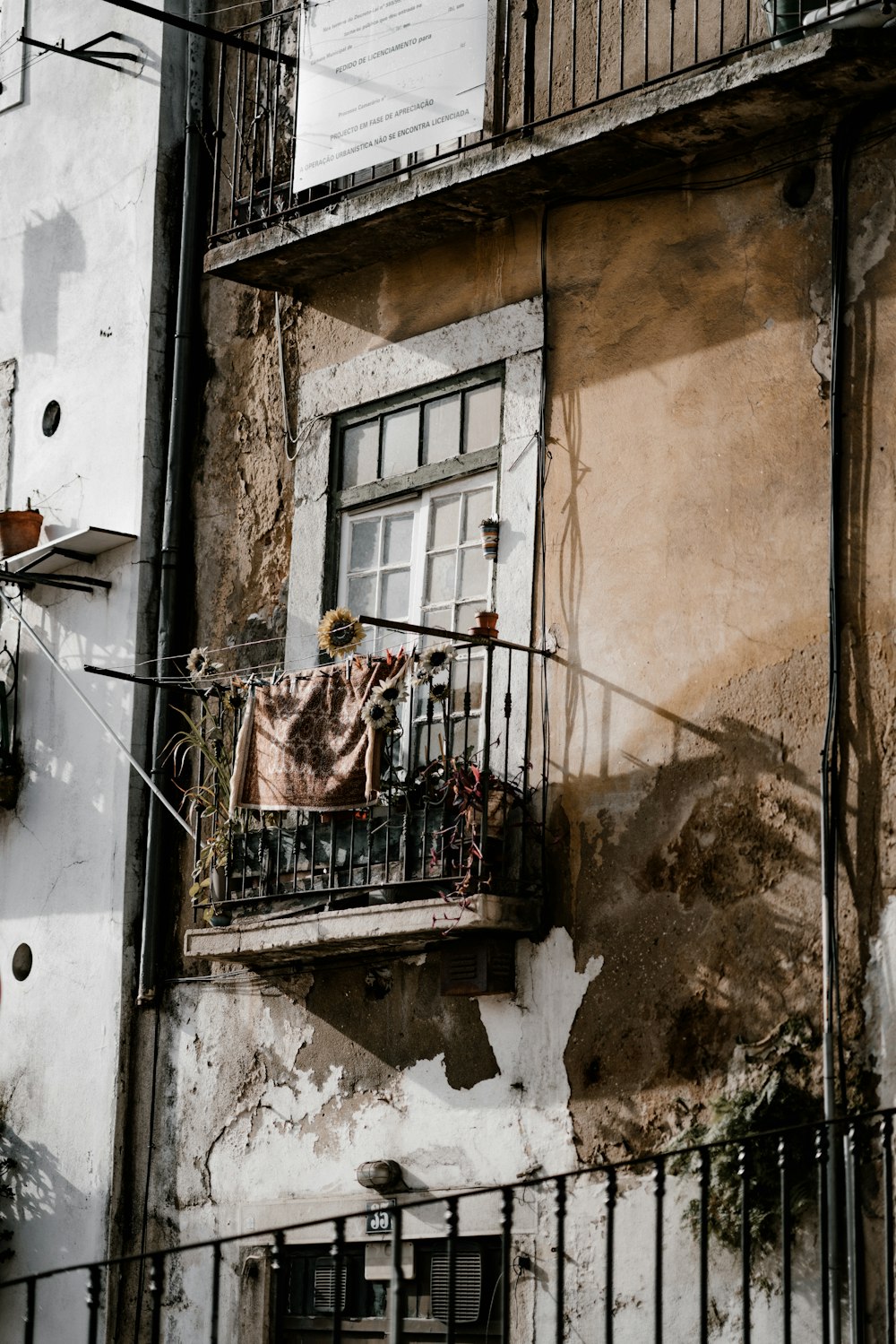 brown textile hanging on balcony