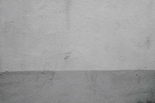 A freshly painted exterior wall with smooth finishing and subtle color gradients.