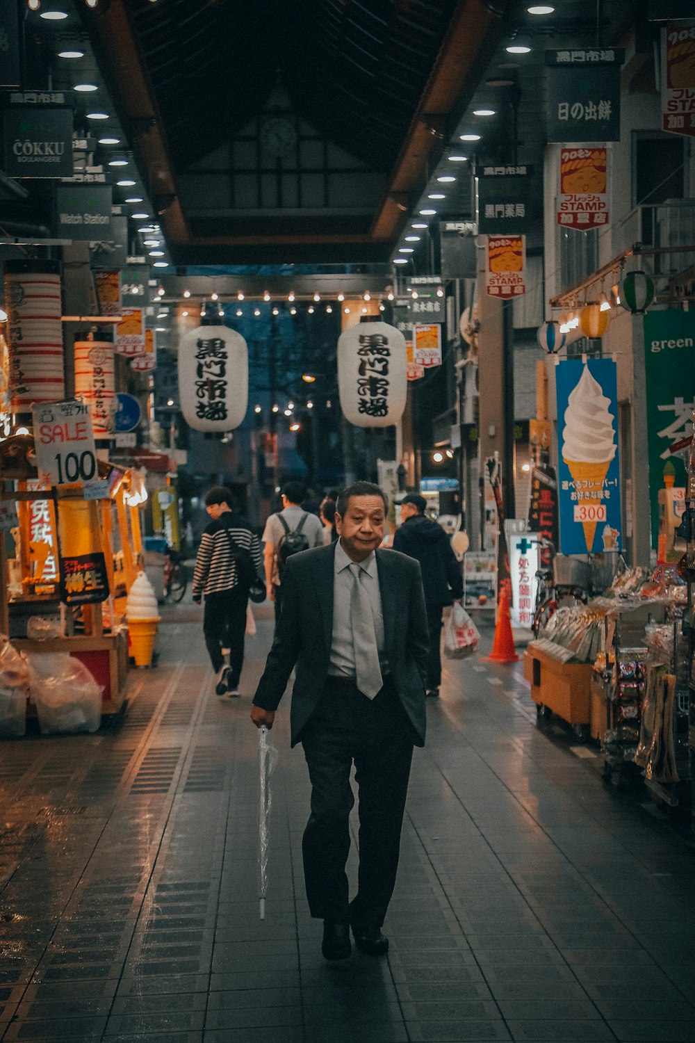 man walks on gray pathway