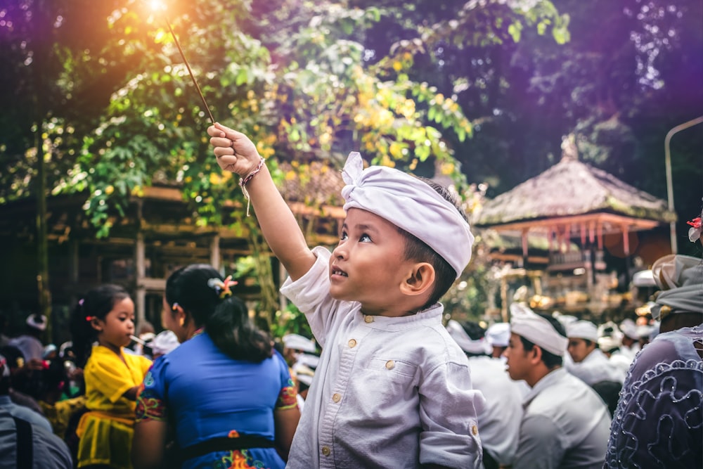 boy holding sparkler