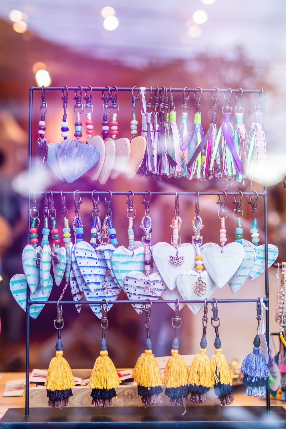 selective focus photo of drop earrings in black rack