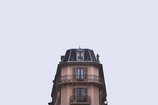 brown and black building under white sky in Aix-les-Bains France