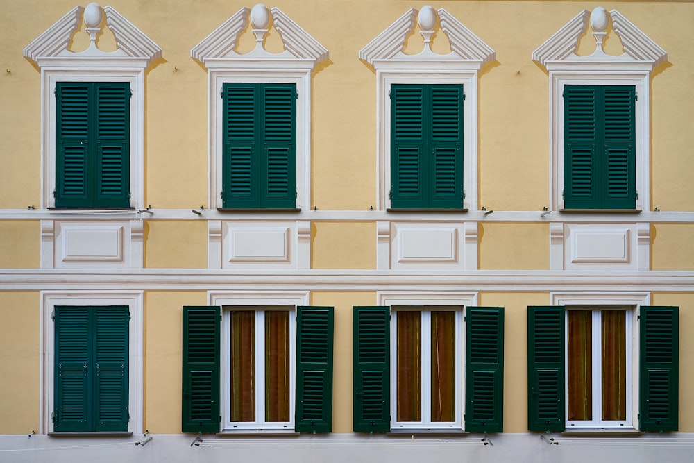 white and blue wooden windows