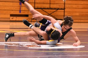 two men diving on floor