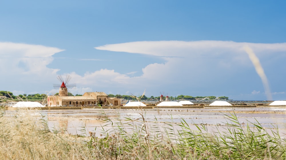 brown house beside body of water during daytime