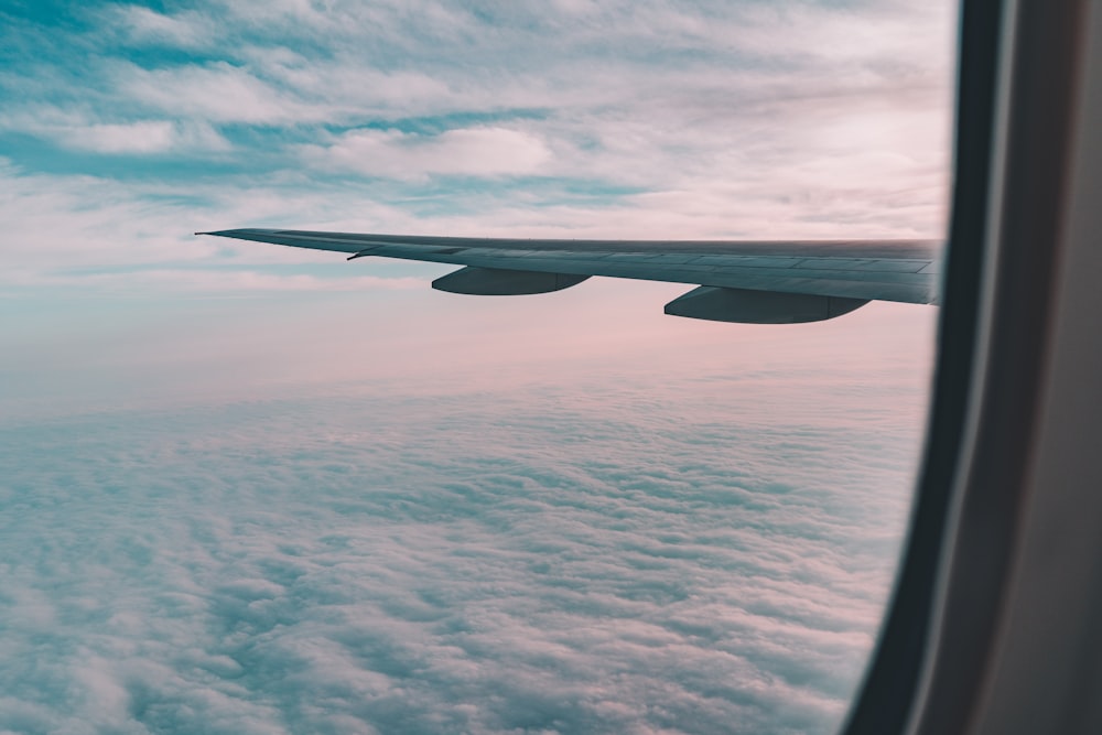 view of clouds through airplane's window