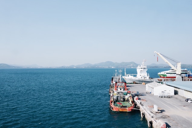 white ship on calm water at daytime